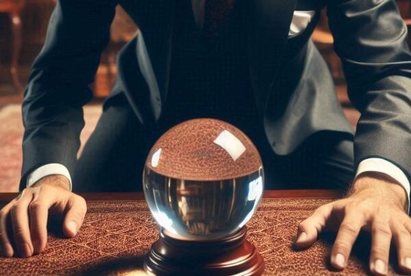 Executive staring into a crystal ball at his desk